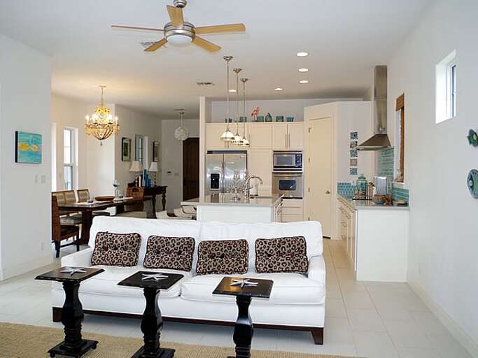 Living room is located directly off of the kitchen and dining areas