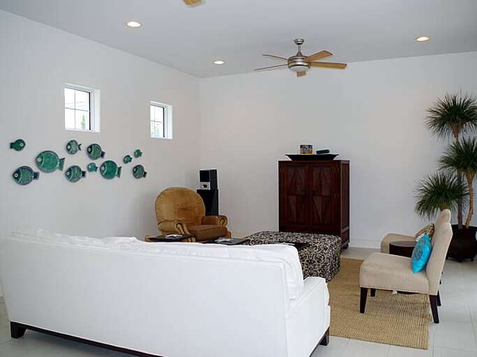 Living room is located directly off of the kitchen and dining areas