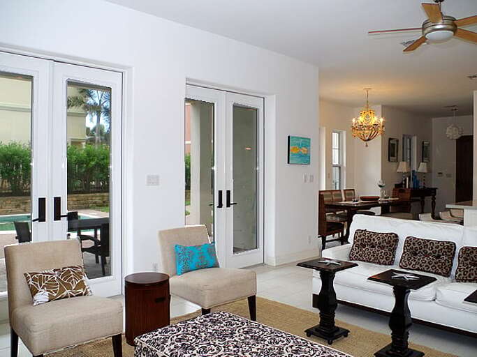 Living room also has two sets of french doors that open up to the private pool area