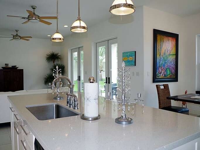 Open concept kitchen with large island and bar seating for six