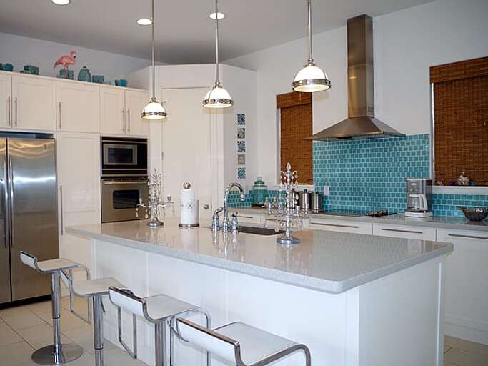 Open concept kitchen with large island and bar seating for six