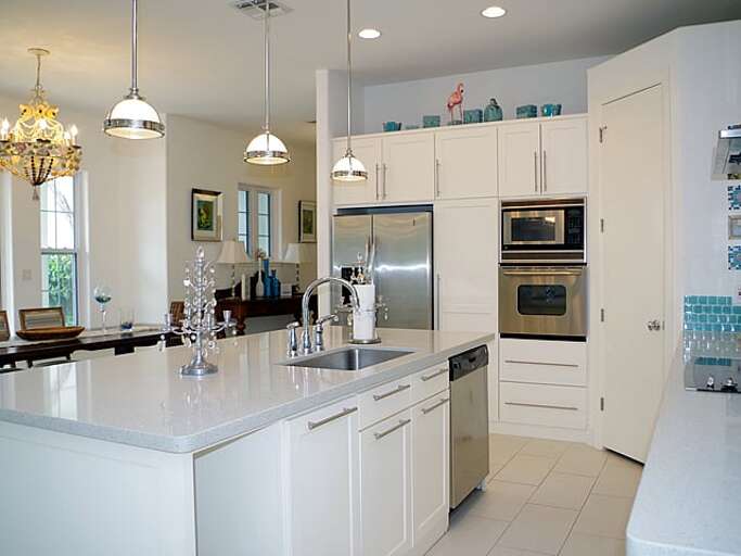 Open concept kitchen with large island and bar seating for six