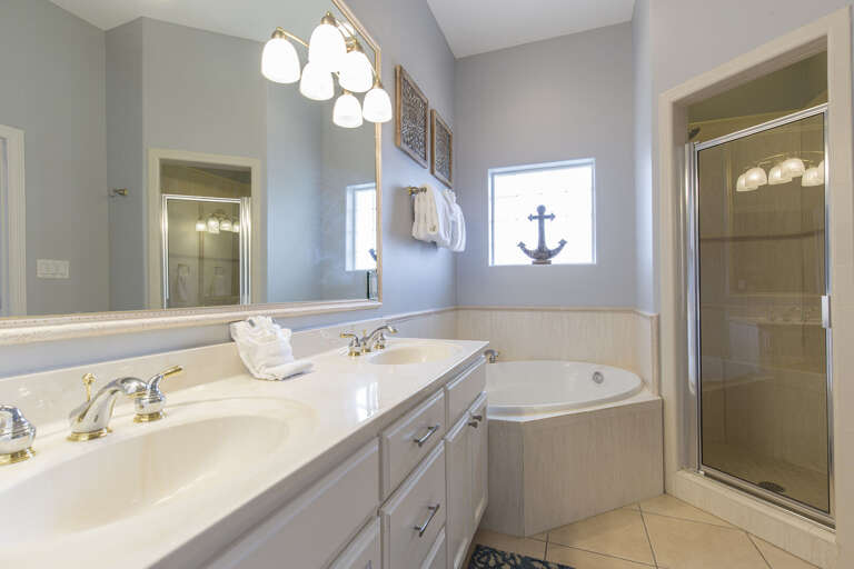 En-suite bathroom with over sized tub and walk in shower.