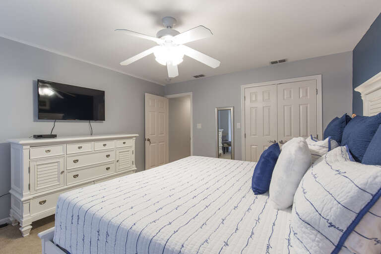Third floor master suite with a king bed.