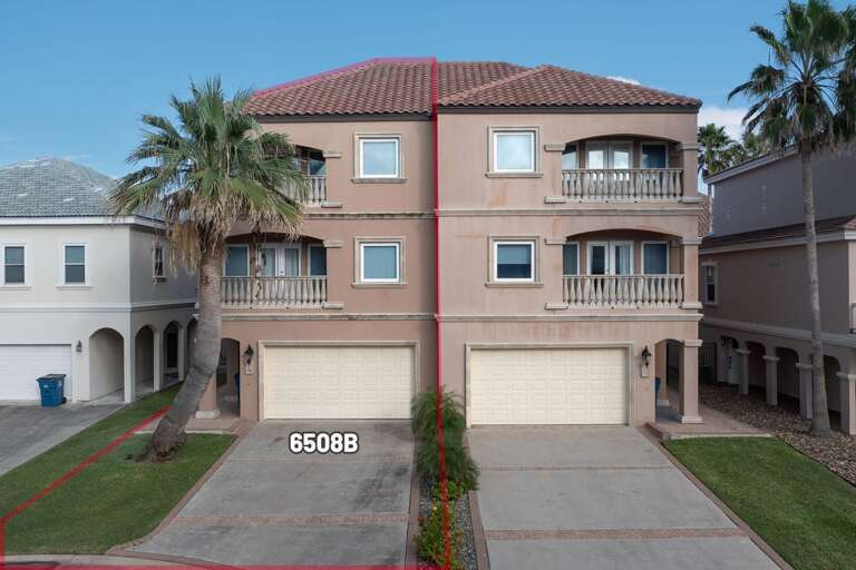 Three-level Residential Building With Balconies And Palm Tree