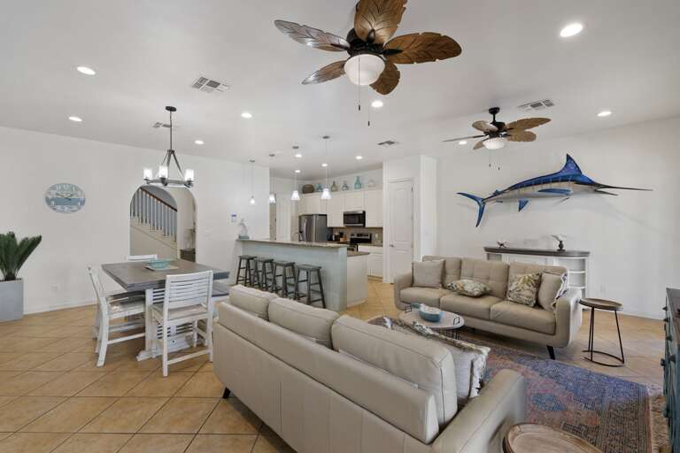 Gorgeous beach-chic private home, featuring a spacious open concept living and dining area, and kitchen.