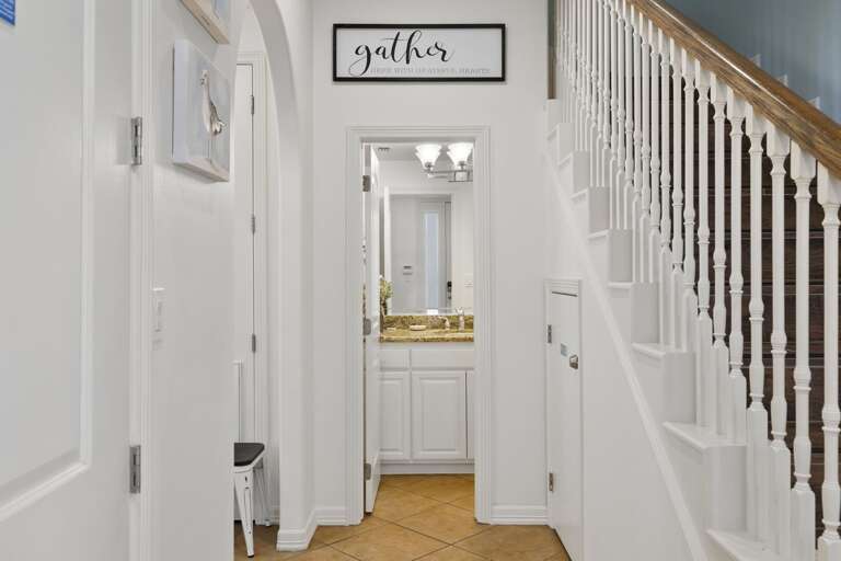 Ground floor entryway with half bathroom.