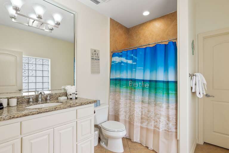 Guest bathroom with  bathtub/shower combination.
