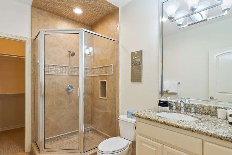 Guest Bathroom with stand-in shower and large closet.
