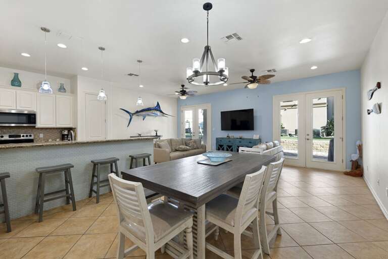 Open concept kitchen and dinning area. Dining table sits 6, additional seating at the bar for 4 guests.