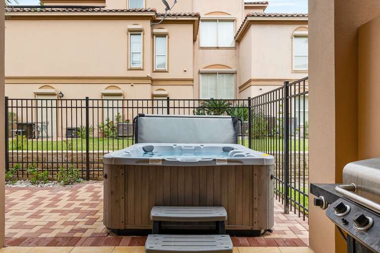 Private patio with outdoor seating,  grill and hot tub