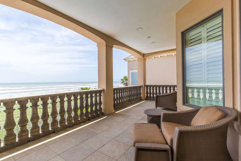 Second-floor balcony overlooking the beach. Views for miles & miles!