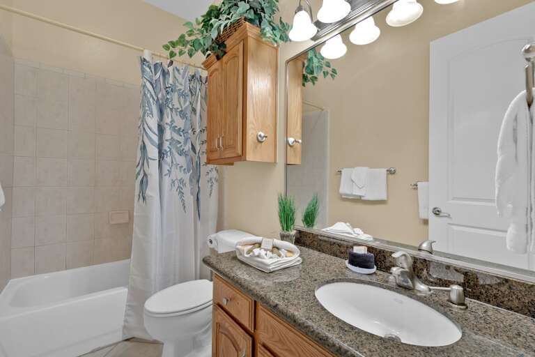 Guest bathroom with shower tub combination. Guest bathroom with shower tub combination.