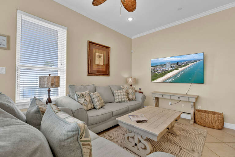 Living Area surrounds a large flat screen TV Living Area surrounds a large flat screen TV