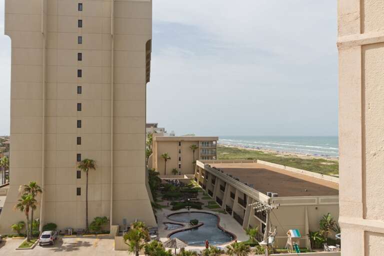 Balcony view facing northeast (partial beach view).