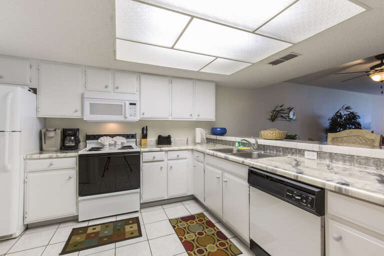 Spacious kitchen stocked with cooking utensils Spacious kitchen stocked with cooking utensils