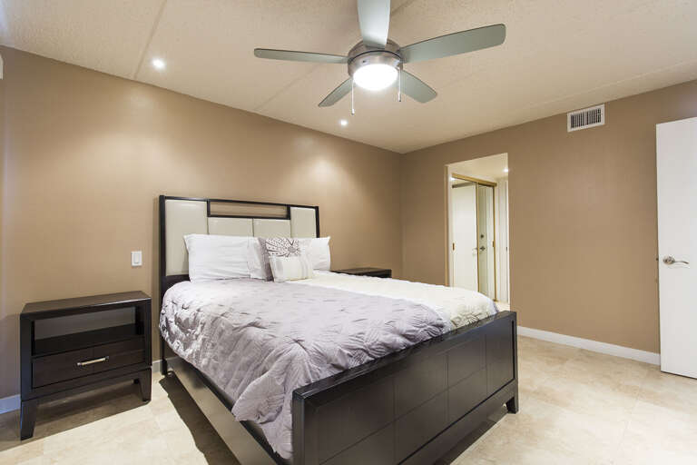 Master bedroom with a queen bed,