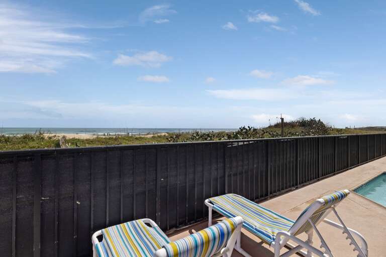 Striped Sun Loungers By Seaside Pool