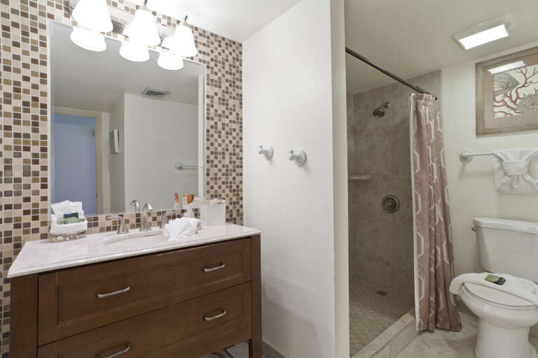 Shared bathroom with shower.