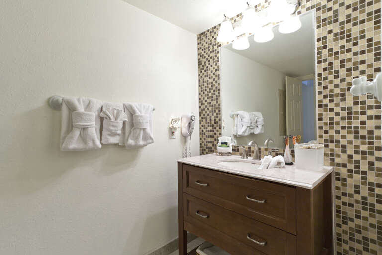 Shared bathroom with shower.