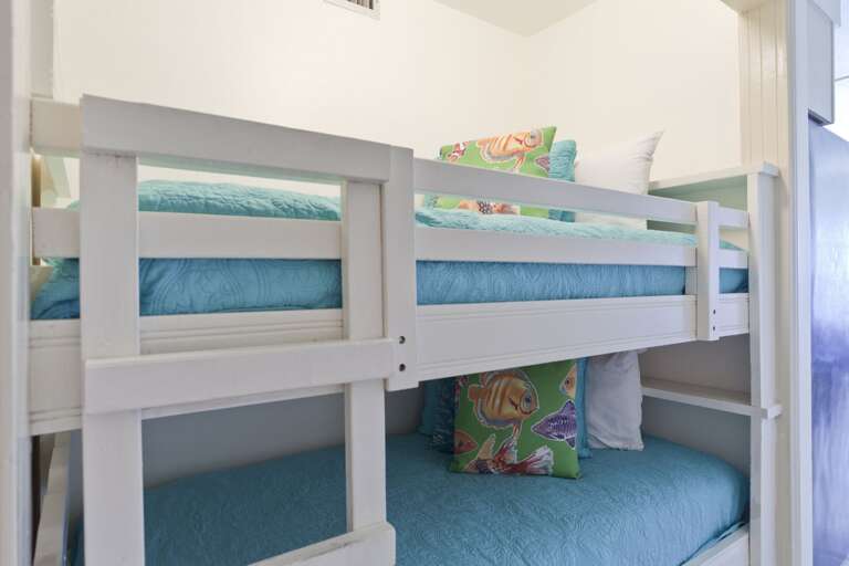 Twin bunk beds located in a nook off the hallway (this is not a bedroom, it is an open area off the hallway, kitchen & living room).