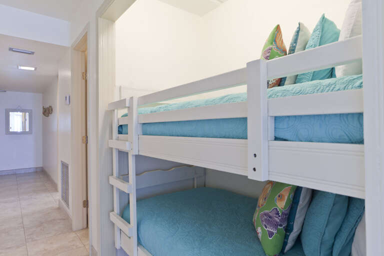 Twin bunk beds located in a nook off the hallway (this is not a bedroom, it is an open area off the hallway, kitchen & living room).