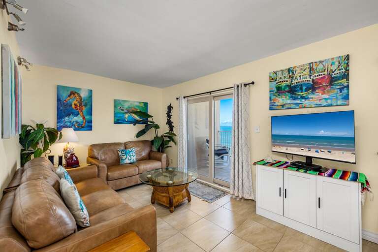 Double sliding doors off the living/ dining areas provide great views of the beach. You won't forget you're on island time now! Double sliding doors off the living/ dining areas provide great views of the beach. You won't forget you're on island time now!