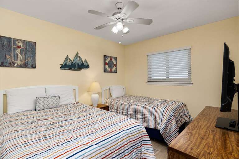 Guest bedroom with a full and twin bed.