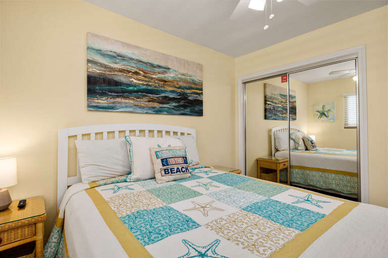 Master bedroom with a Queen size bed and flat screen TV.