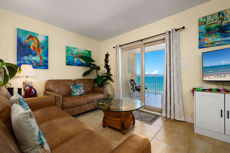 Open concept living room offers you a place to sit back and relax indoors while looking out at the Gulf of Mexico!