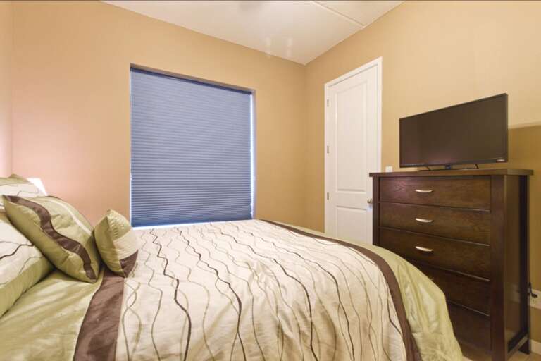 Guest bedroom with queen bed.