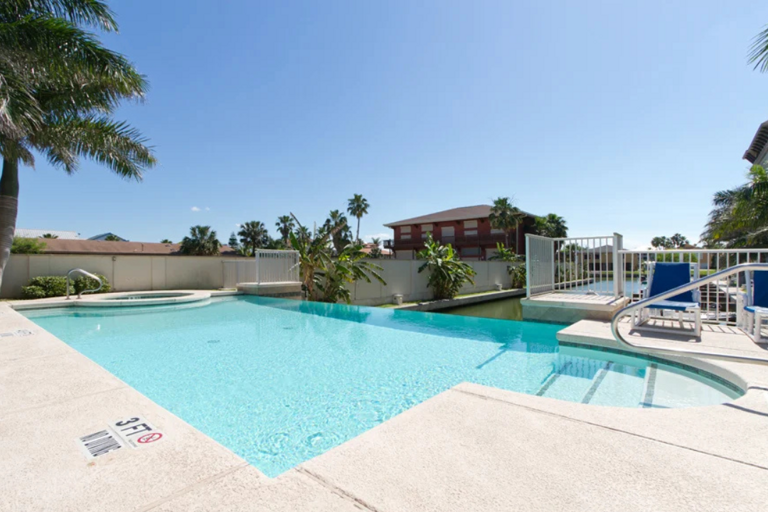 Spend your days lounging by the waterfront infinity pool and relaxing in the hot tub.