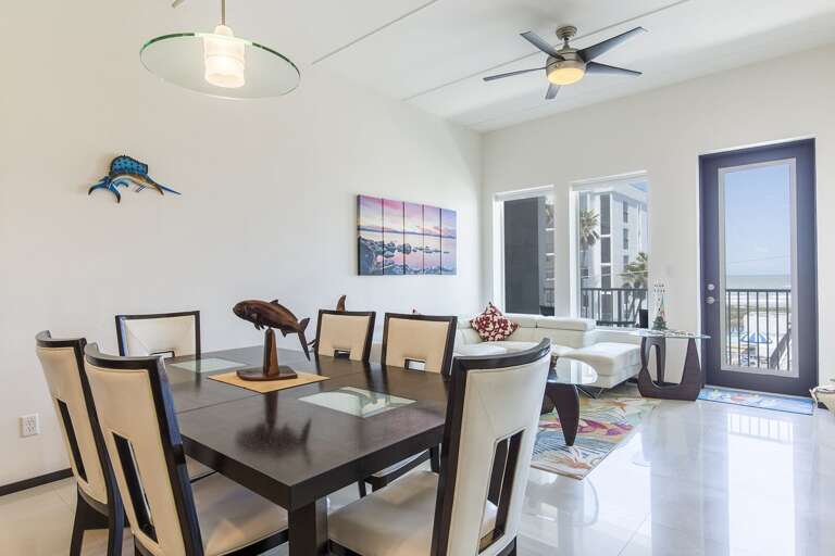 Dining and living area with beach views.