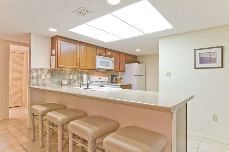 This kitchen bar offers extra seating for guests to enjoy