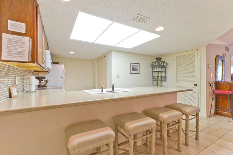This kitchen bar offers extra seating for guests to enjoy
