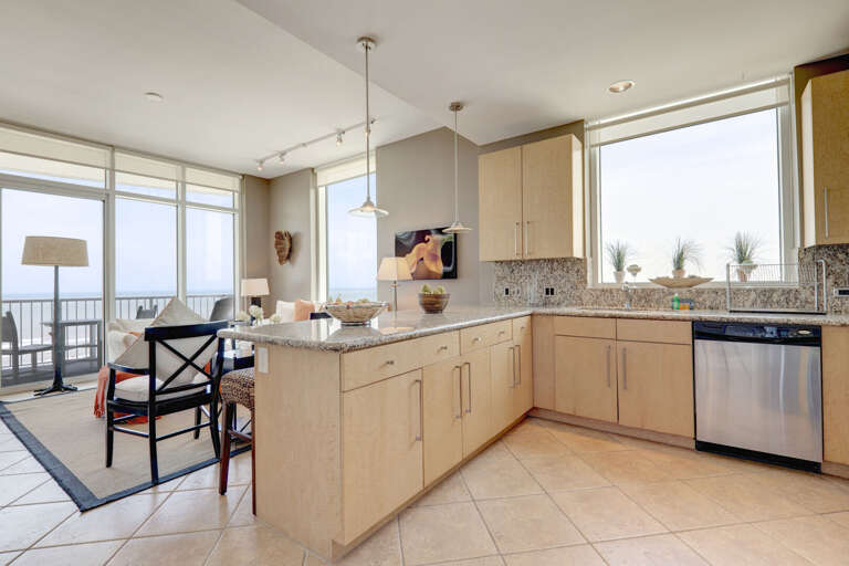 Amazing kitchen fully stocked with cooking utensils and stainless steel appliances!
