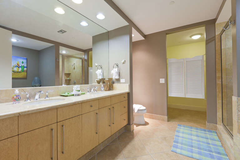 Master bathroom with his and hers sinks and a walk-in closet. Master bathroom with his and hers sinks and a walk-in closet.