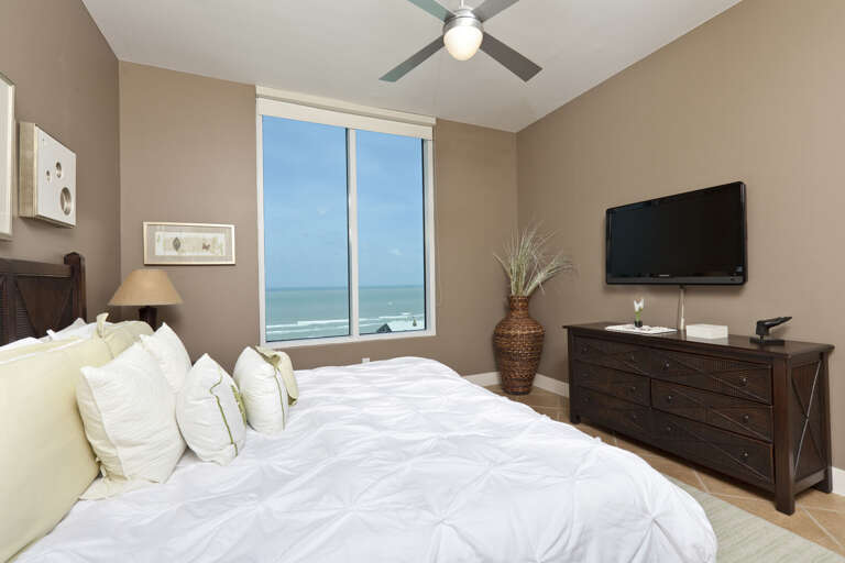 Master bedroom with a king bed and views of the beach!