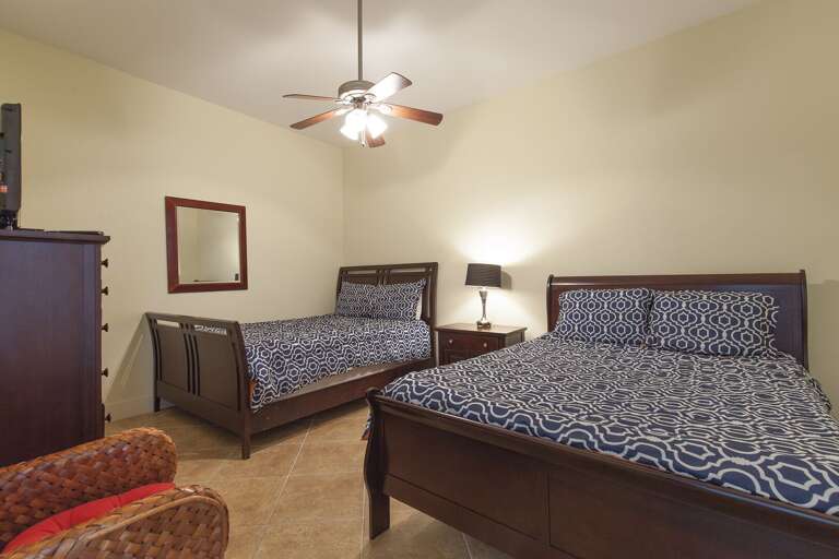 2nd bedroom provides two Full beds & flat screen TV.