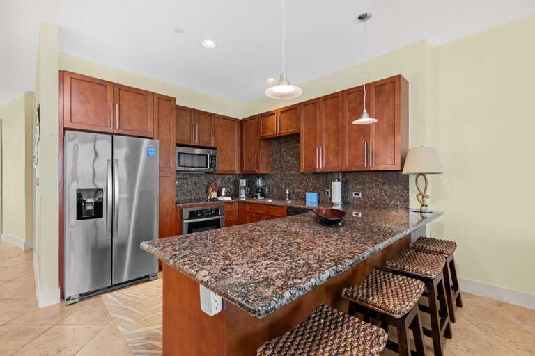 Amazing kitchen fully stocked with cooking utensils and stainless steel appliances!