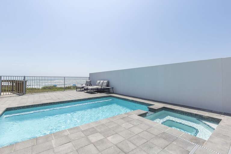 Private heated pool and hot tub with beach views. Private heated pool and hot tub with beach views.