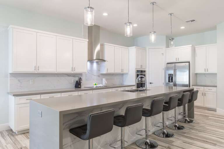 Grand center island with seating for 6 people. *Pantry is not for guest use.