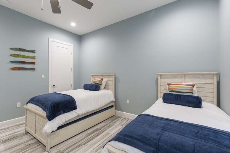 Guest bedroom with twin beds featuring trundle beds each (ground floor)