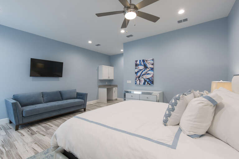 Master bedroom with a king bed