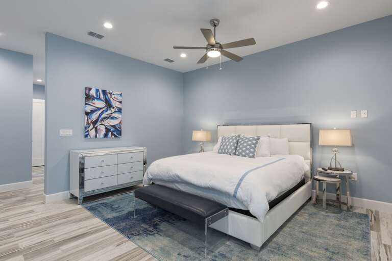 Master bedroom with a king bed and private balcony