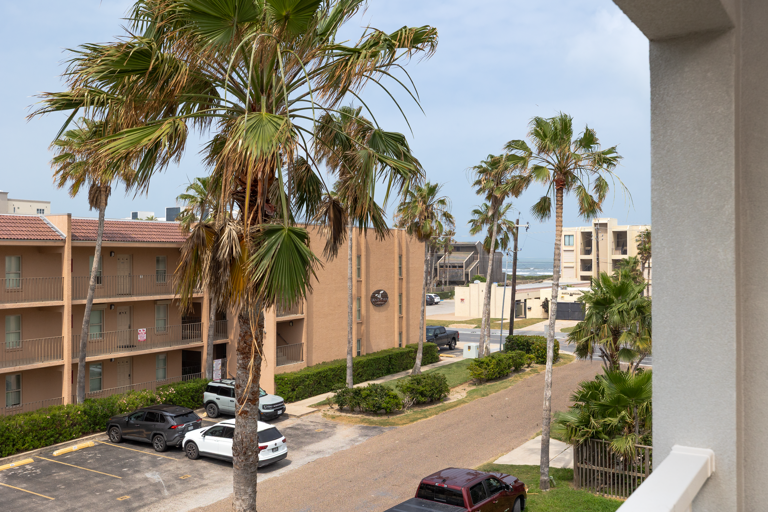 2nd floor front balcony with street view, steps from the beach located off the living room.