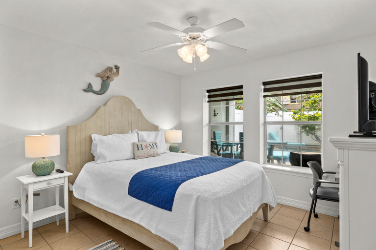 Downstairs guest bedroom with queen bed.