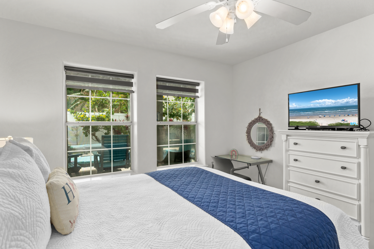 Guest bedroom has a flat screen TV and overlooks the private pool!