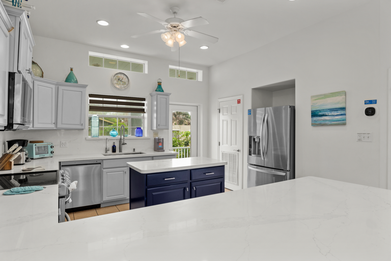 Kitchen has access to the 2nd floor balcony that overlooks the pool.