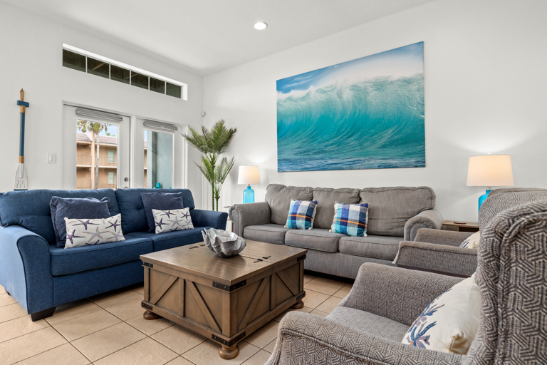 Living room and front balcony access.